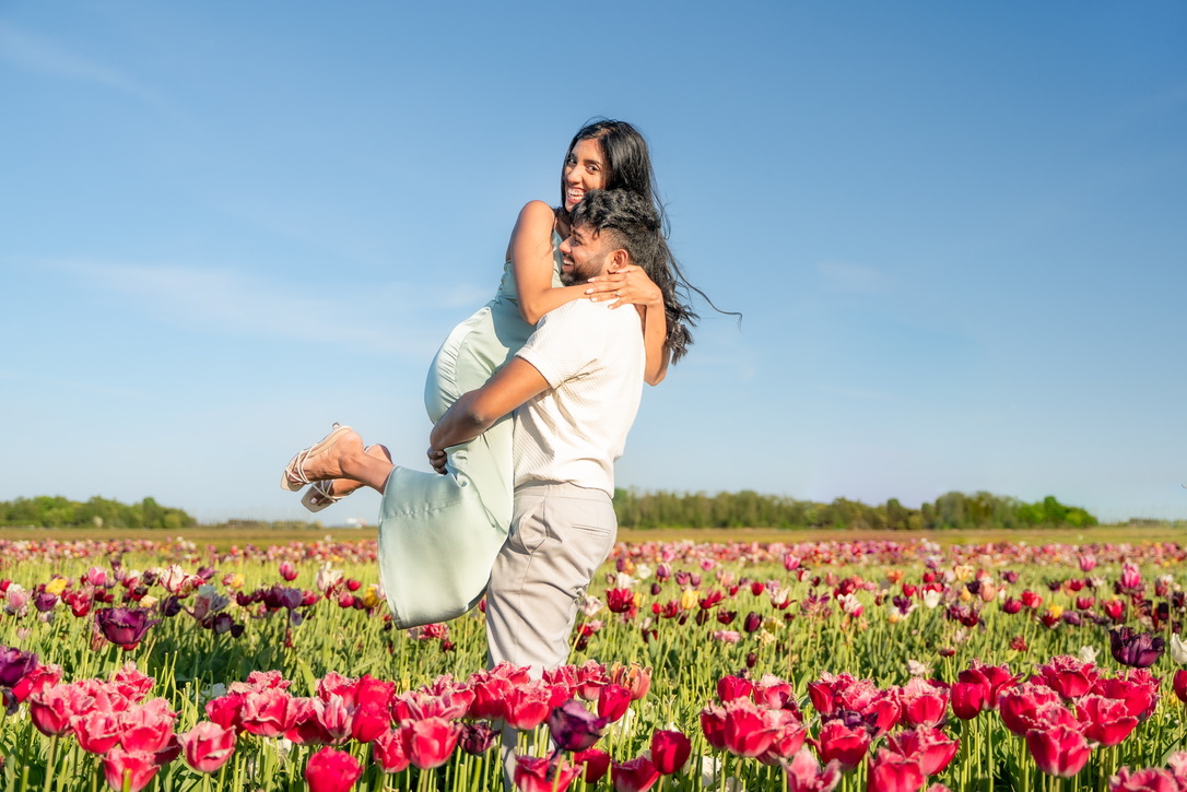 Shajeethan lifting Sheffinea above the tulips